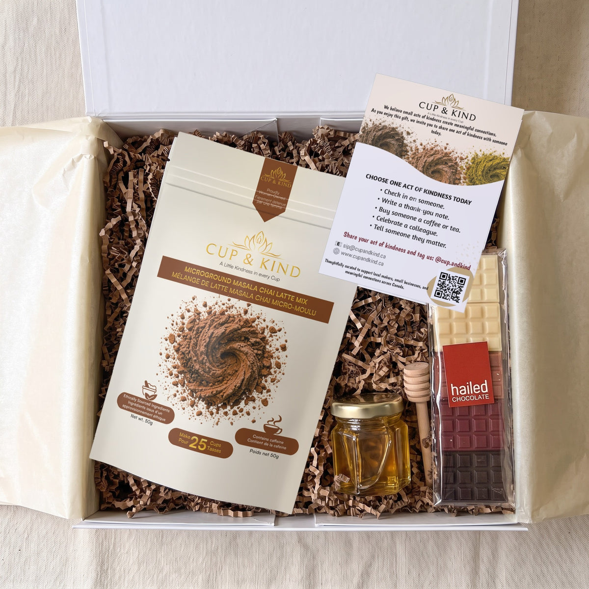 The Connection Box corporate gift box with a Masala Chai latte pouch, Ontario honey, Hailed chocolate and the Kindness Card
